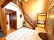 Elegant foyer featuring tiled floors, a wooden staircase, and views into adjoining living spaces at 7621 Forest Dr, Fishers, IN 46038