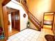 Welcoming foyer with tile flooring, wood staircase, and an open layout at 7621 Forest Dr, Fishers, IN 46038