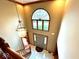 Foyer featuring a bright arched window, tiled floor, and decorative chandelier at 7621 Forest Dr, Fishers, IN 46038