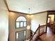 Bright foyer featuring a staircase, and a large window above the front door, creating a welcoming entryway at 7621 Forest Dr, Fishers, IN 46038