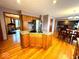 Spacious kitchen featuring wood floors, stainless appliances, granite countertops, and kitchen island at 7621 Forest Dr, Fishers, IN 46038