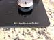 KitchenAid cooktop in island with granite countertops at 7621 Forest Dr, Fishers, IN 46038