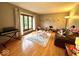 Comfortable living room offering a keyboard, hardwood floors, and lots of sunlight at 7621 Forest Dr, Fishers, IN 46038