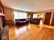 Spacious living room with hardwood floors, comfortable seating, and great natural light at 7621 Forest Dr, Fishers, IN 46038