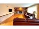 Inviting living room with hardwood floors, brick fireplace, built-in shelves, and comfortable seating at 7621 Forest Dr, Fishers, IN 46038