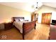 A spacious main bedroom with hardwood floors, vaulted ceilings and natural light at 7621 Forest Dr, Fishers, IN 46038