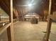 Unfinished attic with exposed beams, plywood flooring, and dormer windows awaiting customization at 7916 N Lasalle Rd, Morgantown, IN 46160