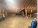 Large attic space featuring exposed wood beams and plywood flooring, ready for conversion at 7916 N Lasalle Rd, Morgantown, IN 46160