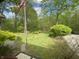 Landscaped backyard with mature trees and greenery offering a serene and private outdoor space at 7916 N Lasalle Rd, Morgantown, IN 46160