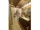 Bathroom with a vanity and sink, tiled floors, a shower with curtain, and a window at 7916 N Lasalle Rd, Morgantown, IN 46160