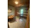 Charming dining area featuring a round table with bar seating and a small table and chairs at 7916 N Lasalle Rd, Morgantown, IN 46160