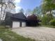 Charming log home with two-car garage, gravel driveway and mature landscaping at 7916 N Lasalle Rd, Morgantown, IN 46160