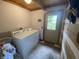 Laundry room with a washer and dryer, a door with views of the yard, and storage space at 7916 N Lasalle Rd, Morgantown, IN 46160