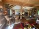 Open-concept living space with a bar, fireplace, and comfortable seating; perfect for gatherings at 7916 N Lasalle Rd, Morgantown, IN 46160