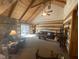 Comfortable living room with a stone fireplace, plush seating, and bright natural light at 7916 N Lasalle Rd, Morgantown, IN 46160