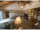 Inviting living room featuring vaulted ceilings, exposed beams, and comfortable seating at 7916 N Lasalle Rd, Morgantown, IN 46160