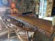 Rustic living area with a live edge wooden bar and comfortable seating at 7916 N Lasalle Rd, Morgantown, IN 46160