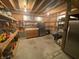 Unfinished storage space featuring wood rafters, concrete floor, shelving and storage at 7916 N Lasalle Rd, Morgantown, IN 46160