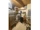 Utility room with a water heater, water softener, shelving, and plenty of storage at 7916 N Lasalle Rd, Morgantown, IN 46160