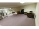 Spacious basement with desk and chairs area, providing ample space for work or hobbies at 8310 Goat Hollow Rd, Martinsville, IN 46151