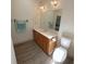 Bathroom featuring natural wood vanity, modern fixtures, and a tiled floor at 8310 Goat Hollow Rd, Martinsville, IN 46151