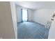 Bright carpeted room with a window providing natural light at 8310 Goat Hollow Rd, Martinsville, IN 46151