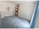 Spacious bedroom with blue carpet, ample closet space, and natural light at 8310 Goat Hollow Rd, Martinsville, IN 46151
