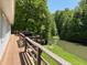 View of home's deck with grill overlooking pond and backyard at 8310 Goat Hollow Rd, Martinsville, IN 46151