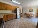 Kitchen featuring oak cabinets, stainless steel appliances, and a dining table with chairs at 8310 Goat Hollow Rd, Martinsville, IN 46151