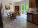 Kitchen area showcasing a dining table, oak cabinets, and a sliding glass door to a patio at 8310 Goat Hollow Rd, Martinsville, IN 46151