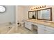 This bathroom features a soaking tub, toilet and and sinks at 8548 Scarsdale W Dr, Indianapolis, IN 46256