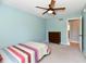 This bedroom features a ceiling fan, a window and a dresser at 8548 Scarsdale W Dr, Indianapolis, IN 46256
