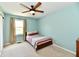 This bedroom features a ceiling fan, a window with curtains and a bed at 8548 Scarsdale W Dr, Indianapolis, IN 46256