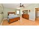 Cozy bedroom with warm wood accents, neutral color palette, and ample natural light at 8548 Scarsdale W Dr, Indianapolis, IN 46256