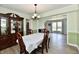 Charming dining room with hardwood floors and ample natural light, creating a welcoming atmosphere at 8548 Scarsdale W Dr, Indianapolis, IN 46256