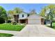 Charming two-story home with a well-maintained lawn, complemented by a basketball hoop and a classic brick facade at 8548 Scarsdale W Dr, Indianapolis, IN 46256