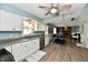 Bright eat-in kitchen with stainless steel appliances, modern cabinetry, and hardwood floors at 8548 Scarsdale W Dr, Indianapolis, IN 46256