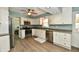 Updated kitchen featuring stainless steel appliances, modern cabinetry, and hardwood floors at 8548 Scarsdale W Dr, Indianapolis, IN 46256