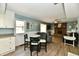 Cozy living room featuring a brick fireplace, comfortable seating, and stylish decor at 8548 Scarsdale W Dr, Indianapolis, IN 46256