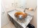 Bathroom vanity featuring modern bowl sink and granite counter top with chrome fixtures and a mirror at 8814 W 30Th St, Indianapolis, IN 46234
