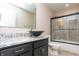 Bathroom featuring modern bowl sink, granite counter top and walk-in shower with glass doors at 8814 W 30Th St, Indianapolis, IN 46234