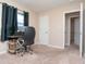 Bedroom features a workspace with a black office chair and computer setup at 8814 W 30Th St, Indianapolis, IN 46234