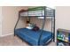 Bedroom with bunk bed and blue quilt at 8814 W 30Th St, Indianapolis, IN 46234