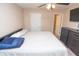 Bedroom with bed, dresser, and access to an open closet at 8814 W 30Th St, Indianapolis, IN 46234