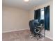 Neutral bedroom featuring a desk and a window with black out curtains for a quiet home office or study at 8814 W 30Th St, Indianapolis, IN 46234