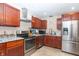 Beautifully designed kitchen featuring stainless appliances, custom cabinetry, and granite countertops at 8814 W 30Th St, Indianapolis, IN 46234