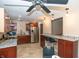 Well-equipped kitchen featuring stainless steel appliances, granite countertops, ample storage and breakfast bar seating at 8814 W 30Th St, Indianapolis, IN 46234