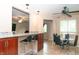 Modern kitchen featuring a breakfast bar, granite countertops, and stainless steel appliances for a sleek look at 8814 W 30Th St, Indianapolis, IN 46234