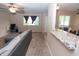 Spacious living room with plush carpeting, stylish seating, and a granite breakfast bar that opens to the kitchen at 8814 W 30Th St, Indianapolis, IN 46234