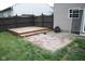 Fenced backyard with a wooden deck and a brick-paver patio area with adjacent grass at 8912 Hosta Way, Indianapolis, IN 46113